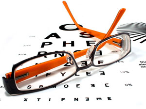 Reading glasses on eye chart